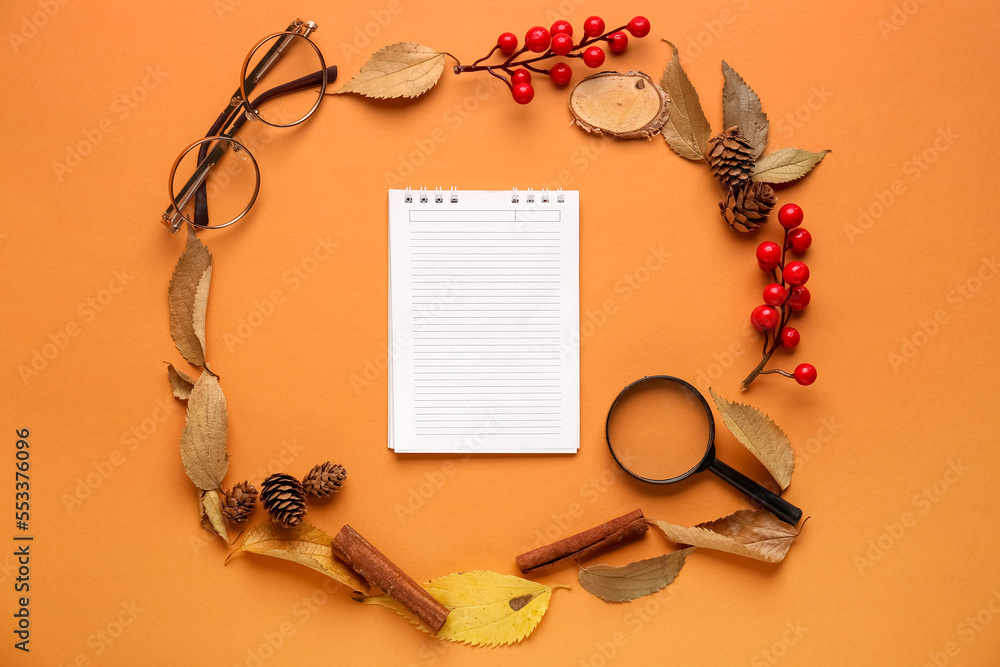 Composition with blank notebook, eyeglasses and natural forest decor on color background