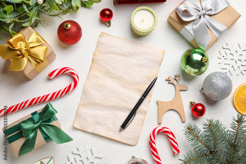 Blank letter to Santa with Christmas decor and gifts on white background