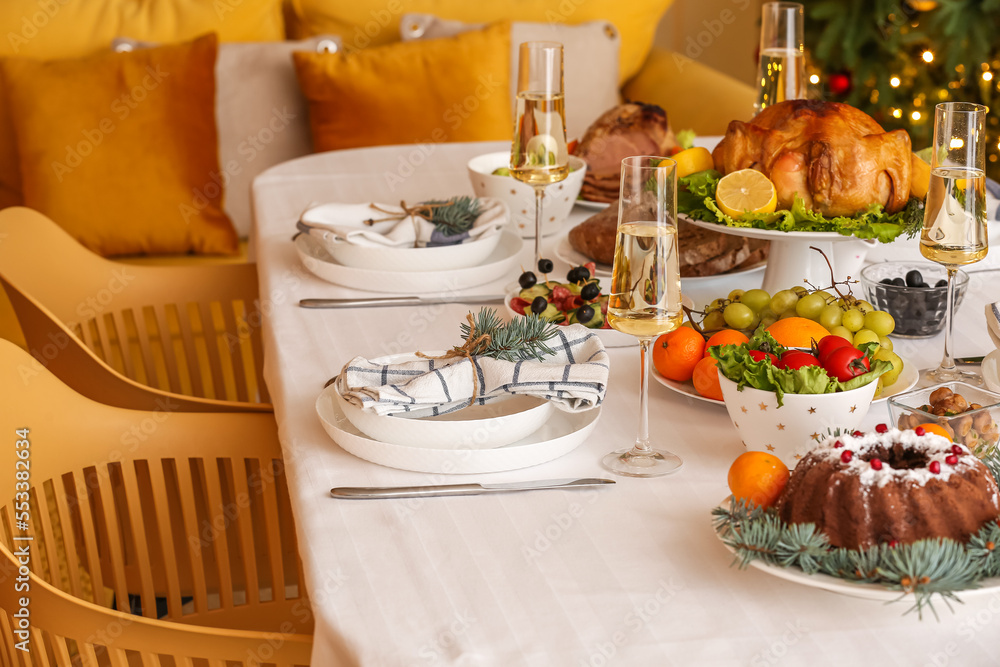 Tasty dishes for Christmas celebration on table