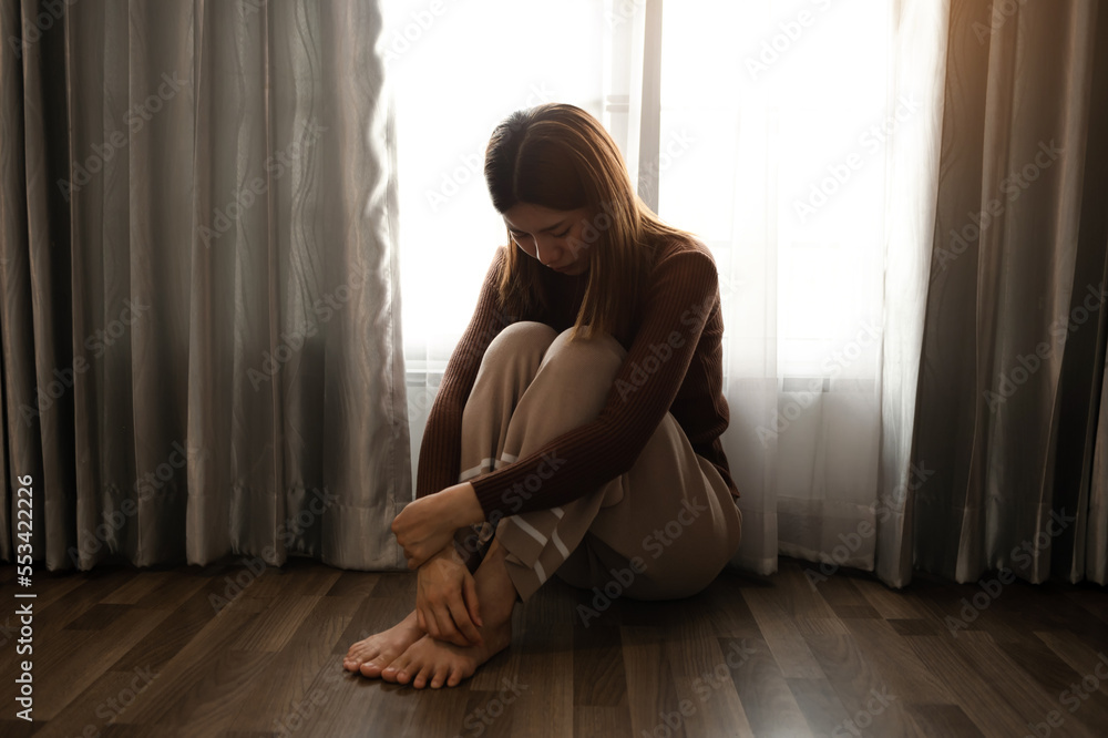 woman sit Depression Standing by window and anxiety Copy space. ..