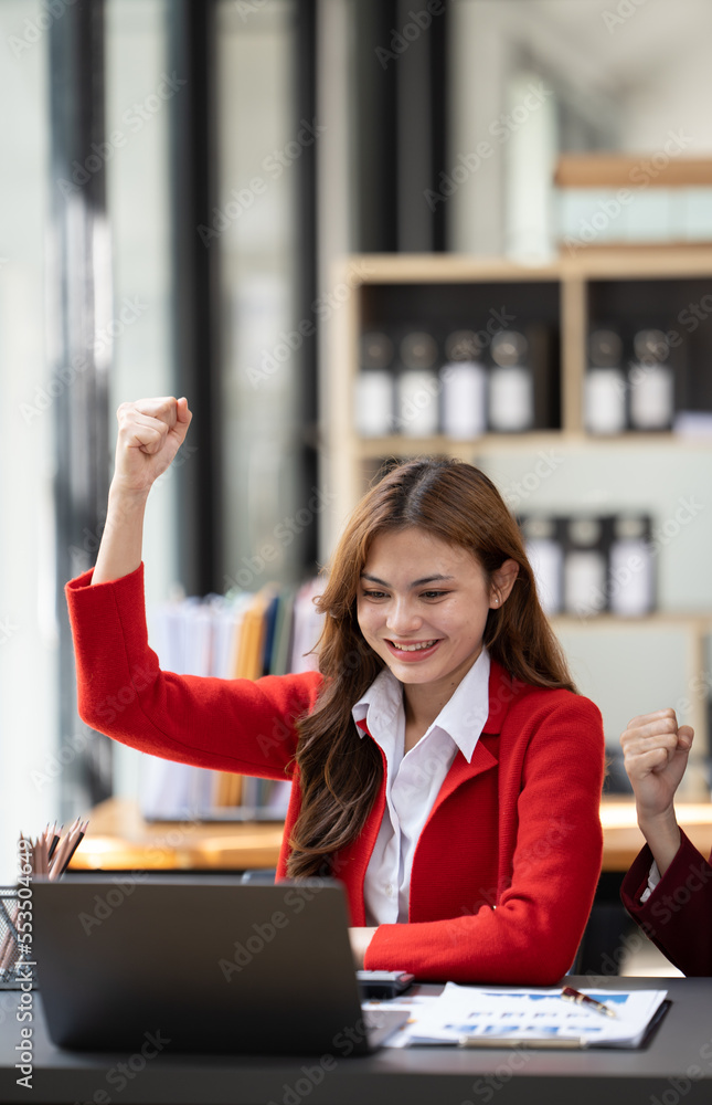 Excited concept, Happy young woman high fiving with colleague in office.