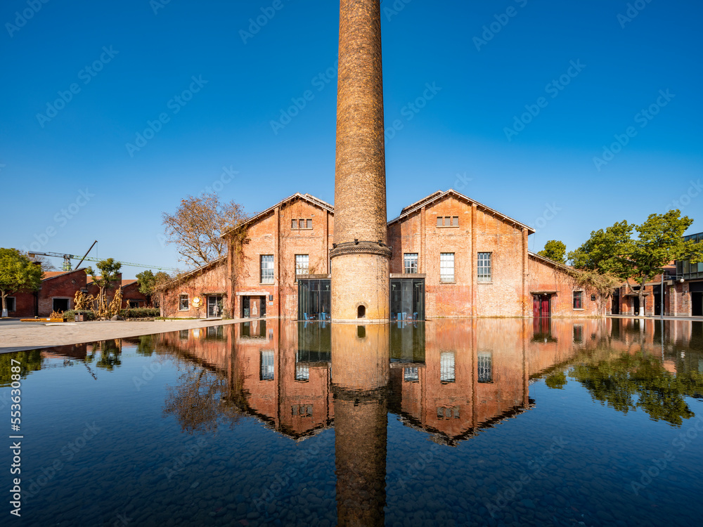 Red old factory building by the water, red brick house，Jingdezhen, Jiangxi, China,