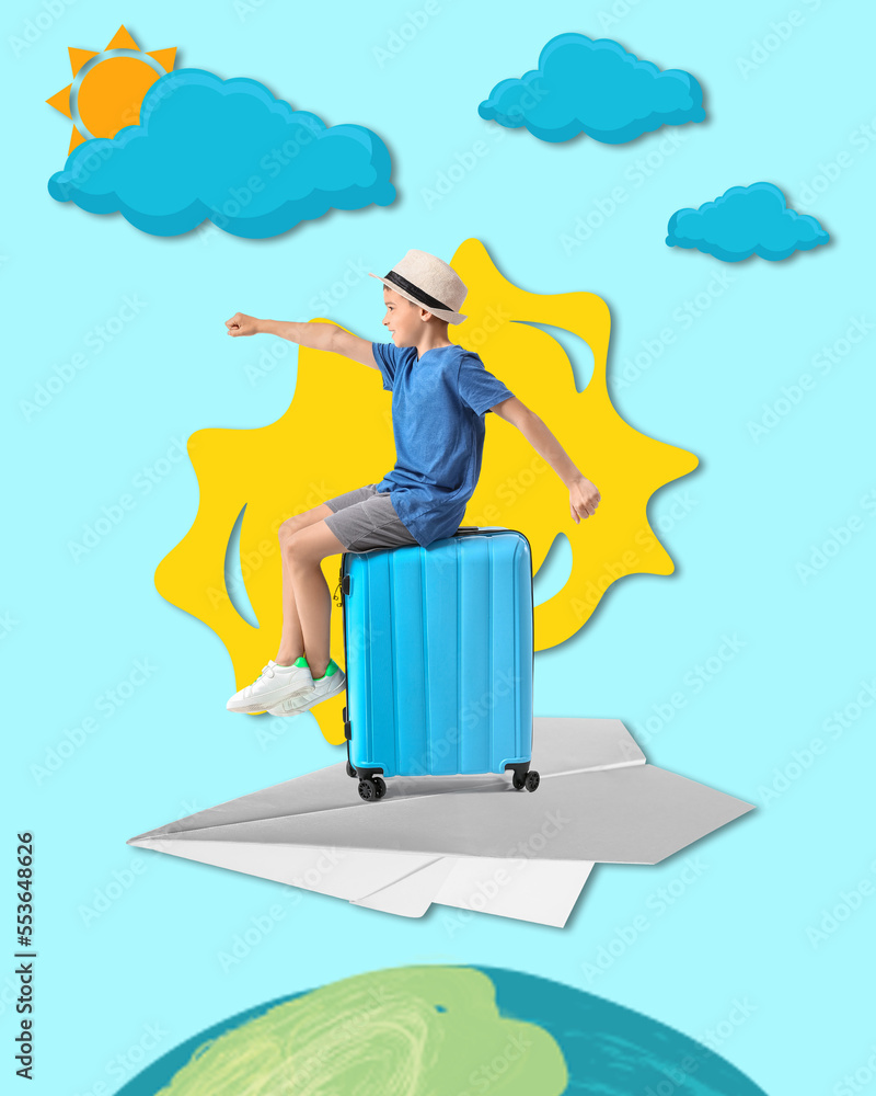 Adorable little boy sitting on suitcase against white background