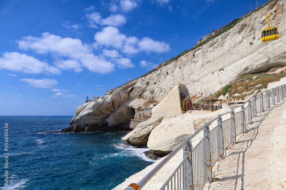 Fenced pathway on crag near sea