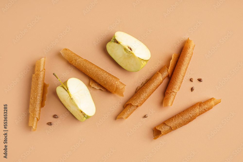 Delicious apple pastilles on color background