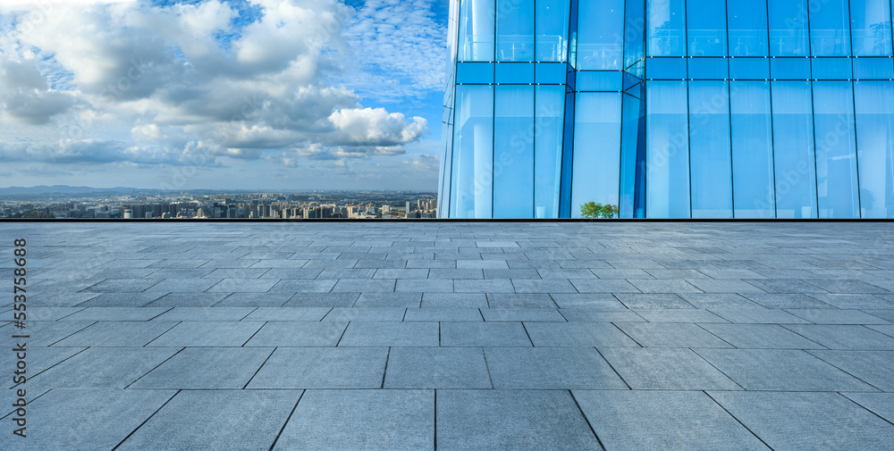 Empty square floor and modern city skyline with buildings in Ningbo, Zhejiang, China.