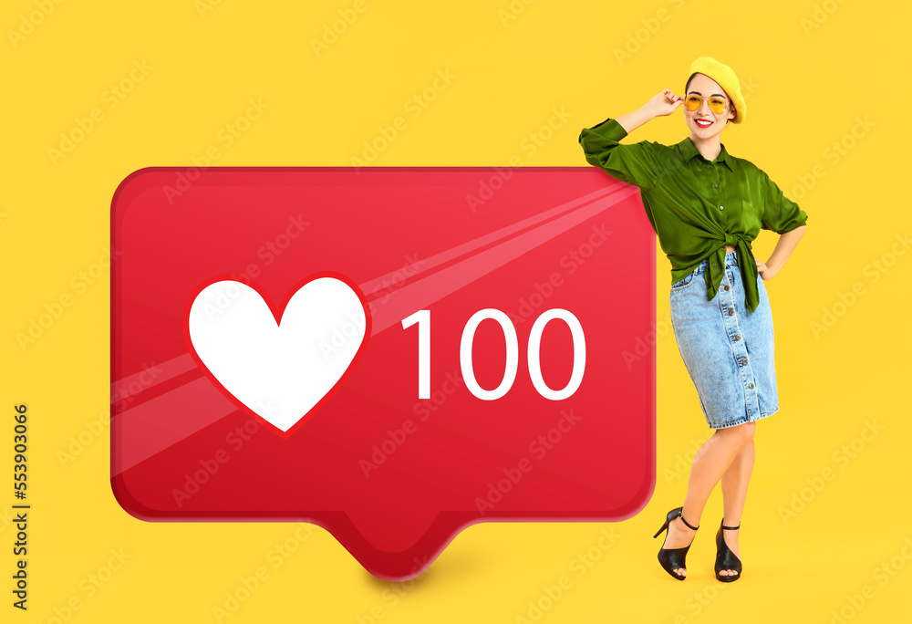 Fashionable Asian woman and big LIKE score sign board on yellow background