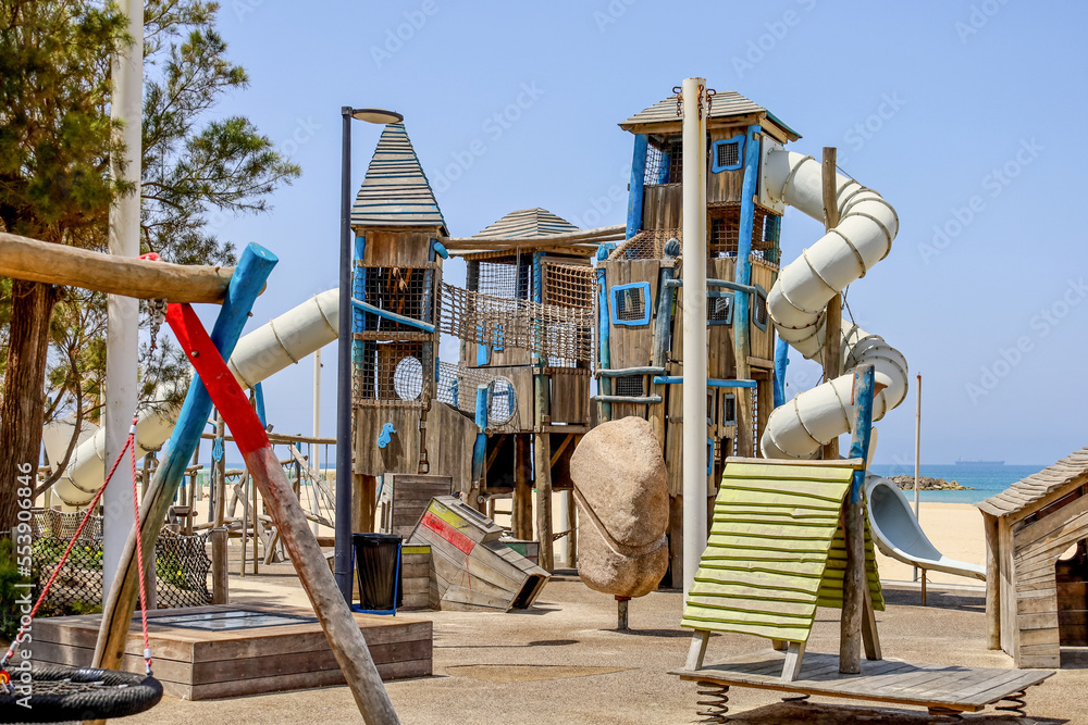 View of childrens complex on playground near sea