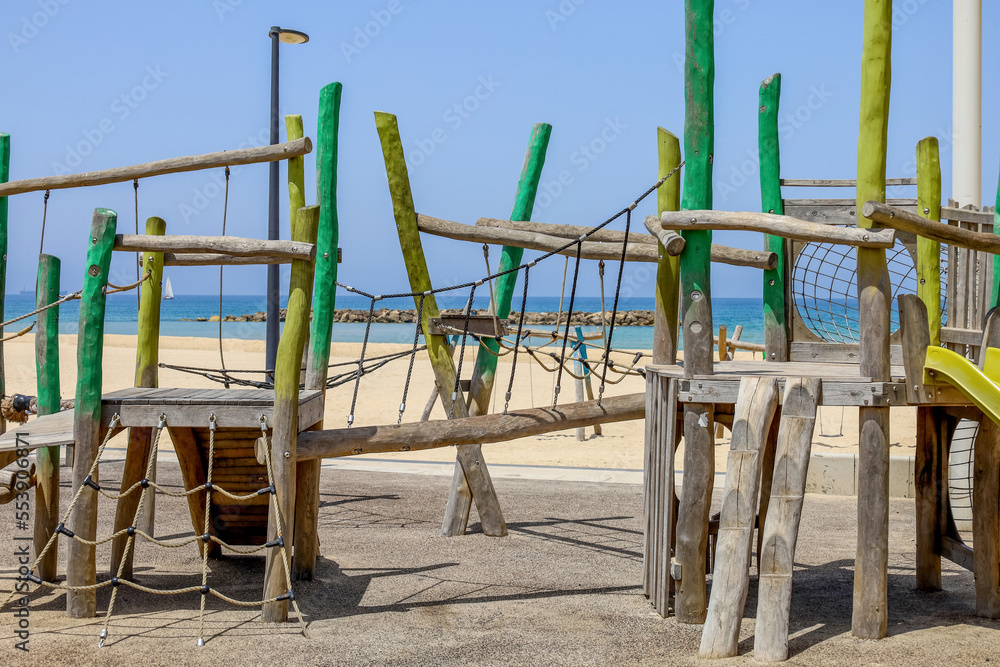 View of childrens complex on playground near sea