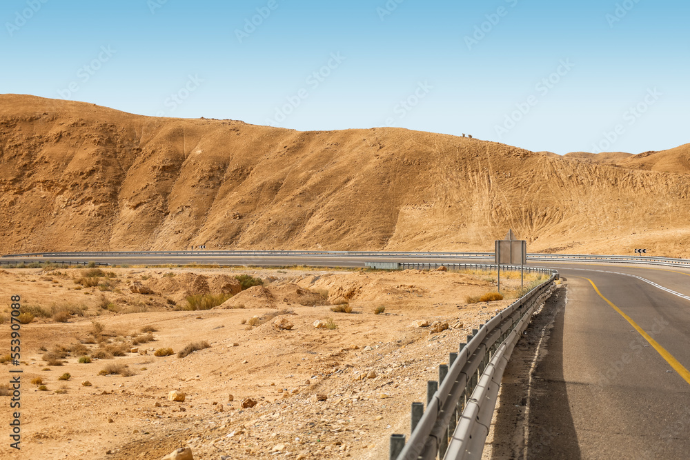 View of beautiful desert with high mountain and road