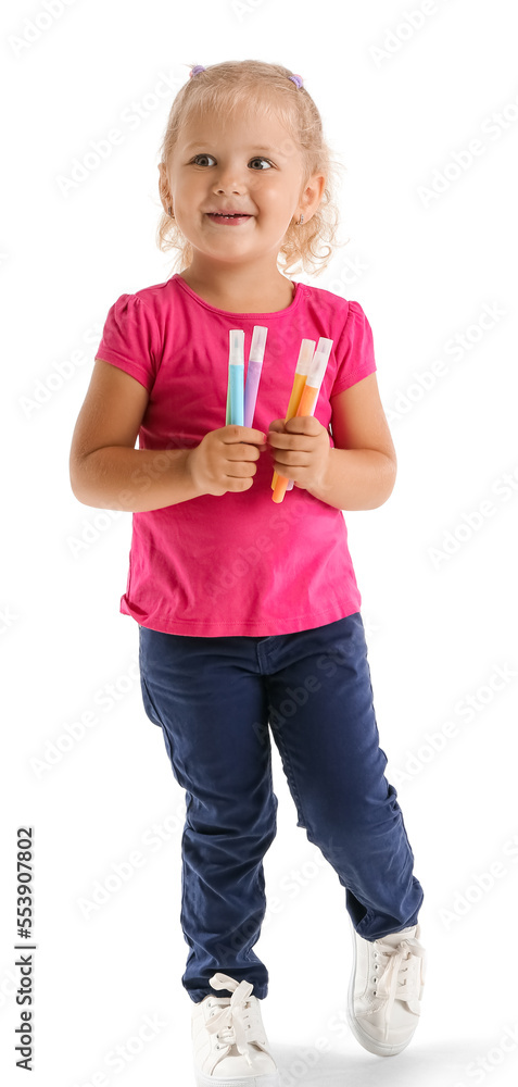 Cute little girl with felt-tip pens on white background