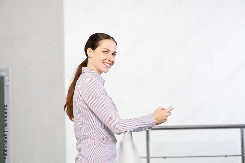 young attractive woman with phone in her hands