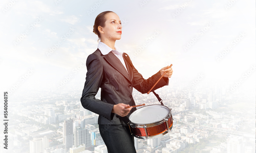 Young business woman with a drum