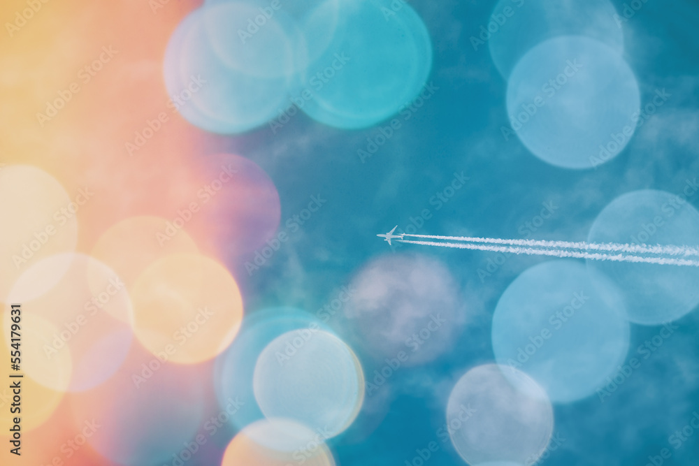 Concept Of Travel. Flying Airplane On Sky Background Soft Colors. Abstract Blurred Bokeh Boke Backgr