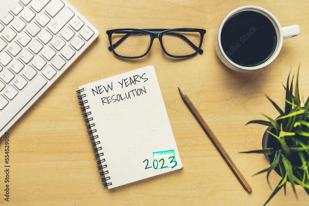 2023 Happy New Year Resolution Goal List and Plans Setting - Business office desk with notebook writ