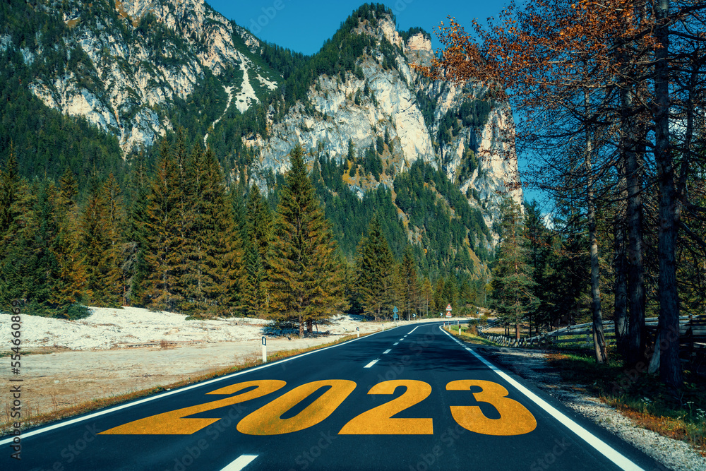 2023 New Year road trip travel and future vision concept . Nature landscape with highway road leadin