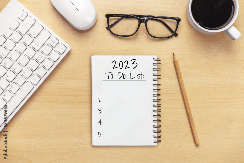 2023 Happy New Year Resolution Goal List and Plans Setting - Business office desk with notebook writ