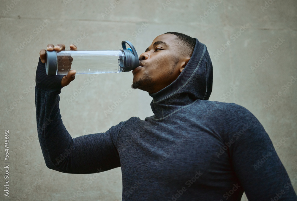 Black man, running and drinking water for health and wellness during exercise, workout and cardio tr