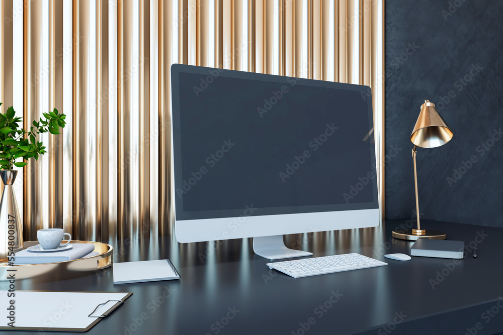 Perspective view on blank dark monitor with space for your text or logo on dark work table with note