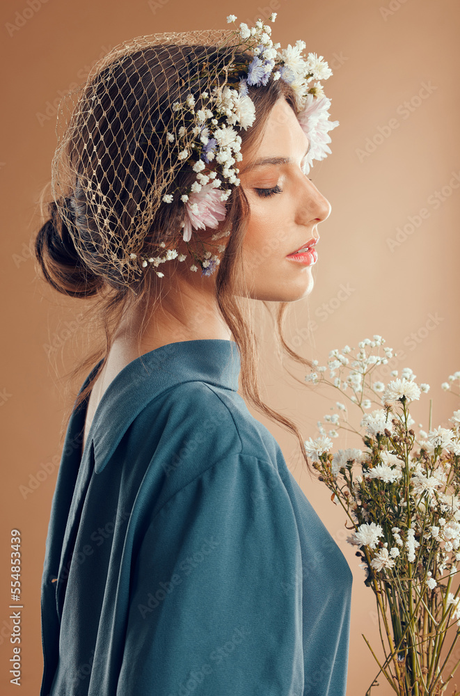 Fashion woman, face or skincare glow and flowers on studio background for spring, trendy or cool sty