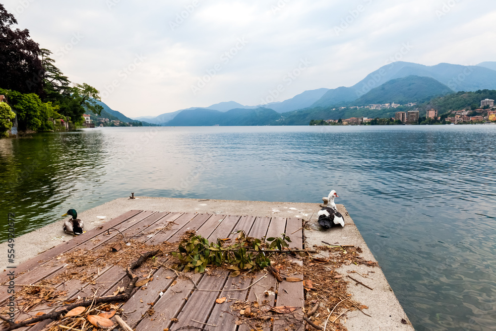 Mountain lake shore and hills in Italy