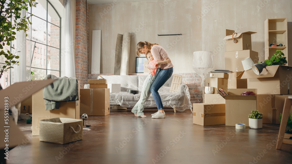 Truly Happy Mother and Daughter Moving Into their New Cozy Home. Cheerful Young Family, Girls Have F