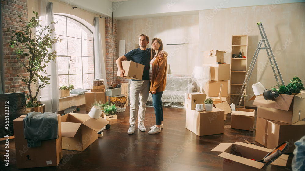 Family New Home Moving in: Happy and Excited Young Couple Enter Newly Purchased Apartment. Beautiful