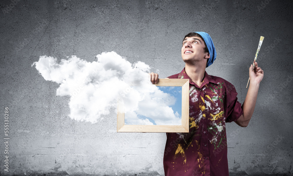 Young artist drawing realistic white cloud