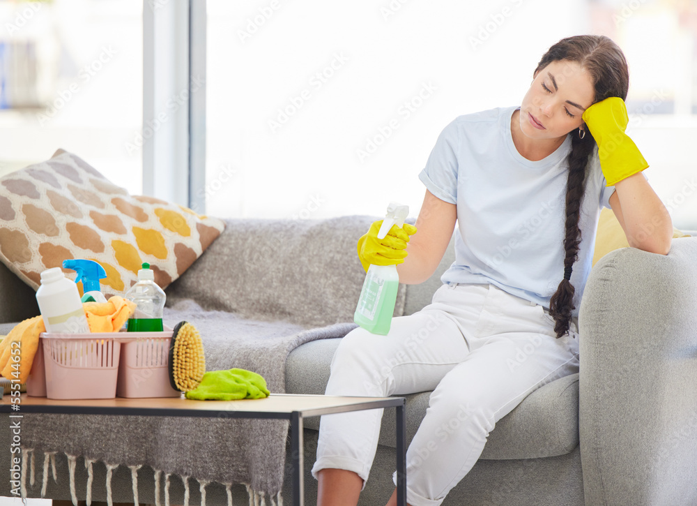 Tired, sad and spring cleaning woman in living room with burnout, stress and fatigue from housekeepi