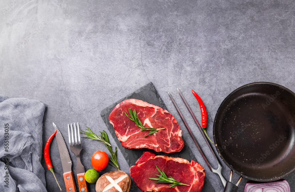 Fresh beef steak on a concrete background