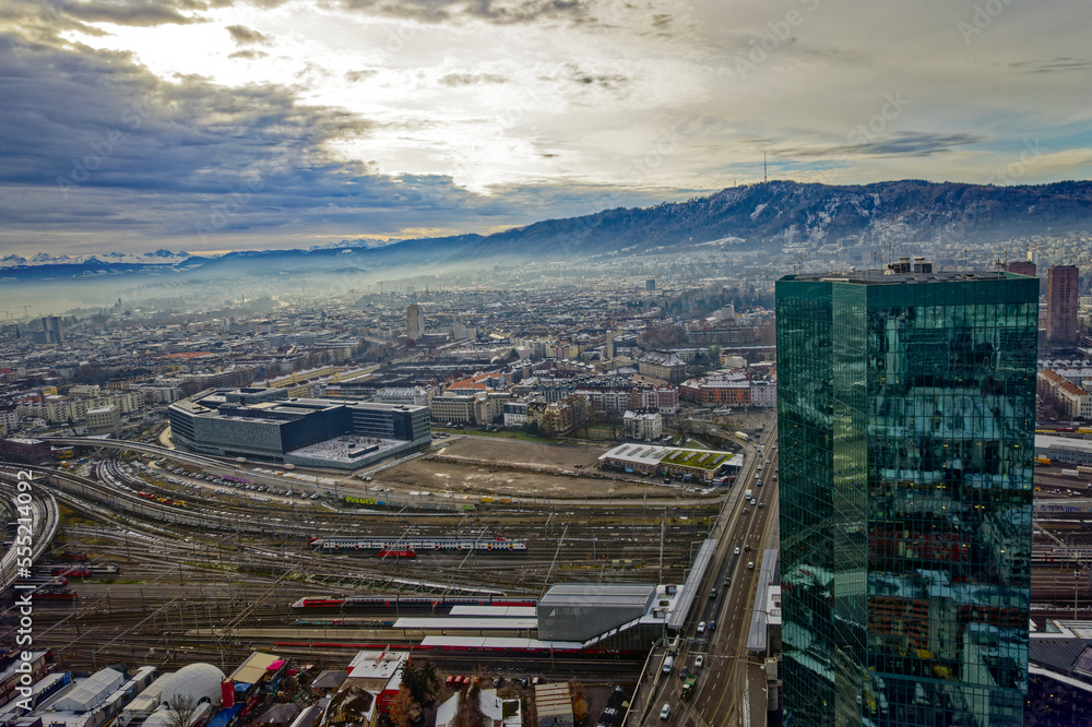 Aerial view of City of Zürich seen from industrial district with skyscraper and local mountain Uetli