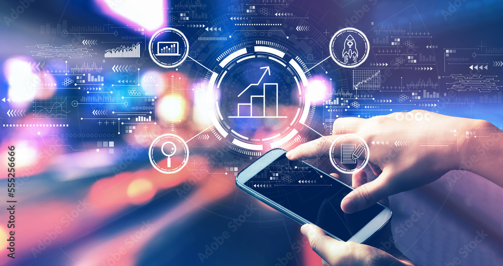 Business growth analysis with person using a smartphone in a city at night