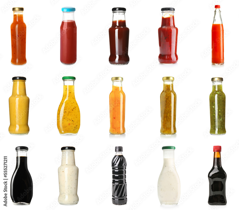 Collection of tasty sauces in bottles on white background