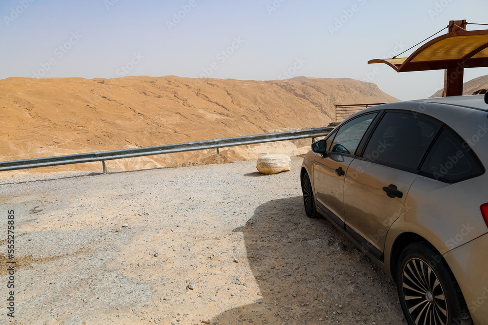 Modern car on road in desert