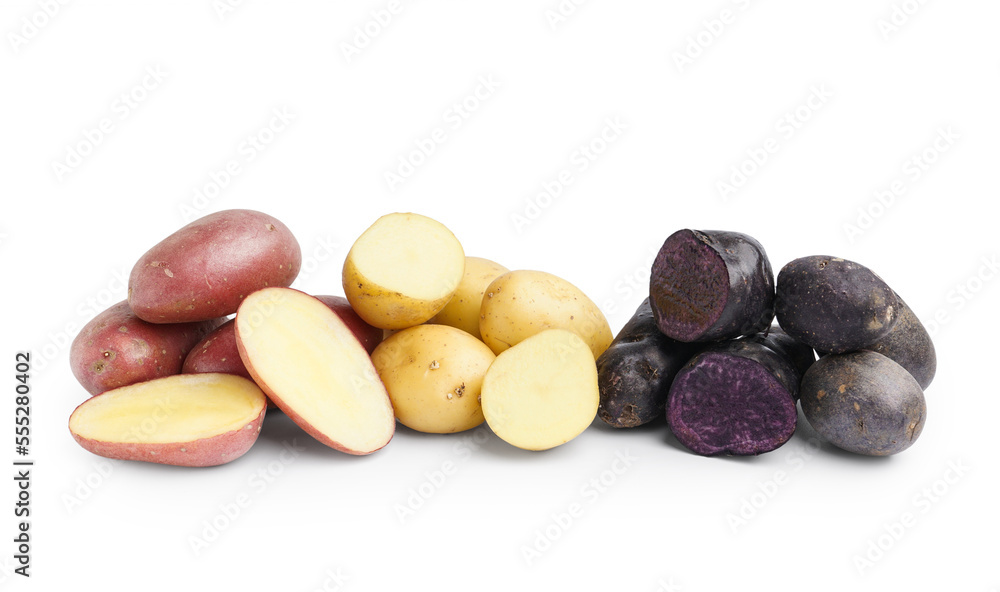 Heaps of different raw potatoes on white background