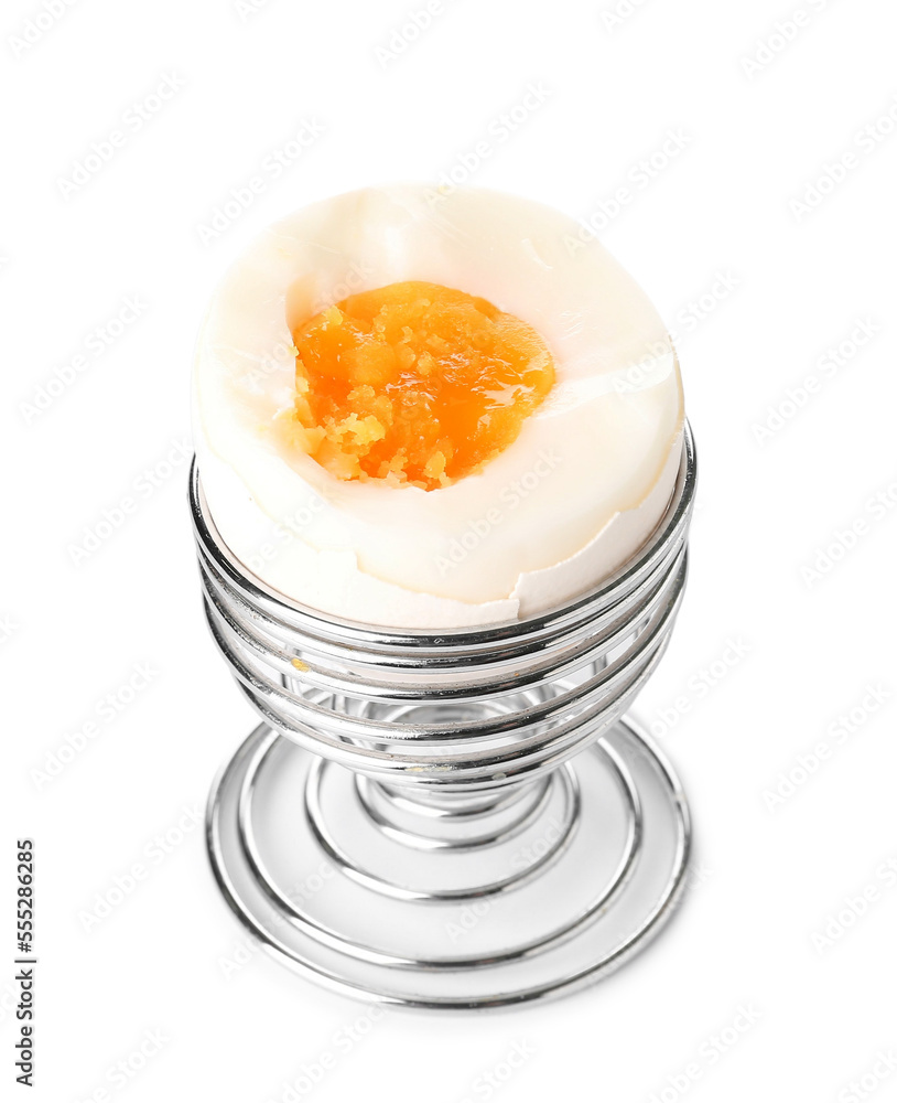 Soft boiled egg in holder on white background