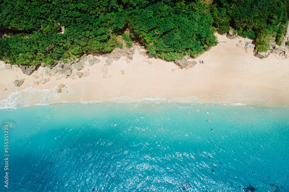 Aerial view of beach with turquoise ocean in tropical island