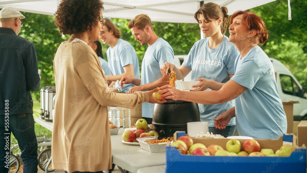 Group of Volunteers Preparing Free Food Rations for Poor People in Need. Charity Workers and Members