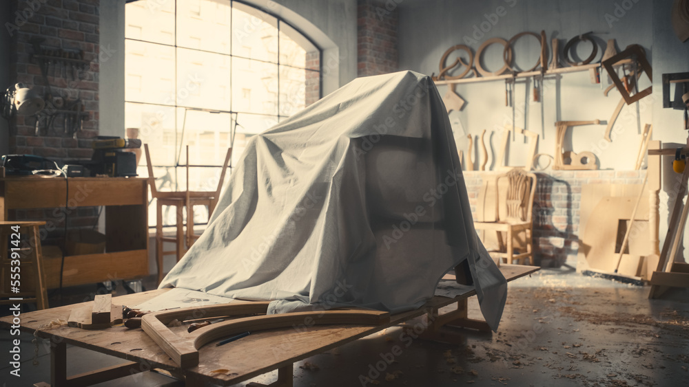 Establishing Shot: Designer Chair Hidden Under a Veil Before Official Presentation in Carpentry Work