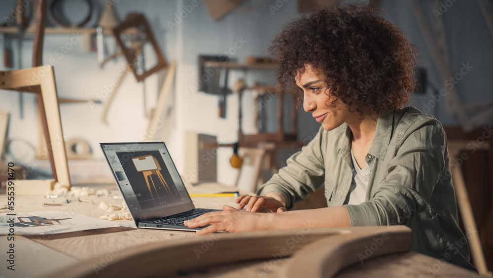 Woodcraft Artist Working on Laptop Computer, Creating a Digital 3D Model of a Stylish Wooden Bedside