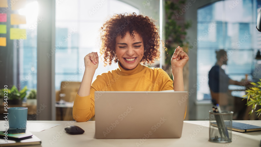 Portrait of a Beautiful Middle Eastern Manager Sitting at a Desk in Creative Office. Young Stylish F