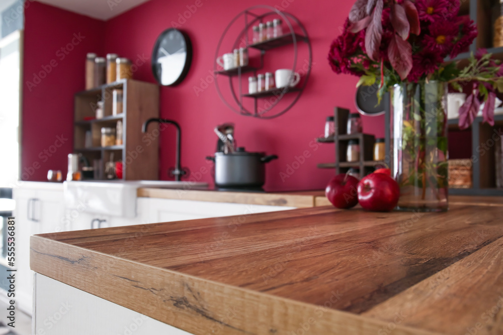 Closeup view of wooden table top in stylish kitchen