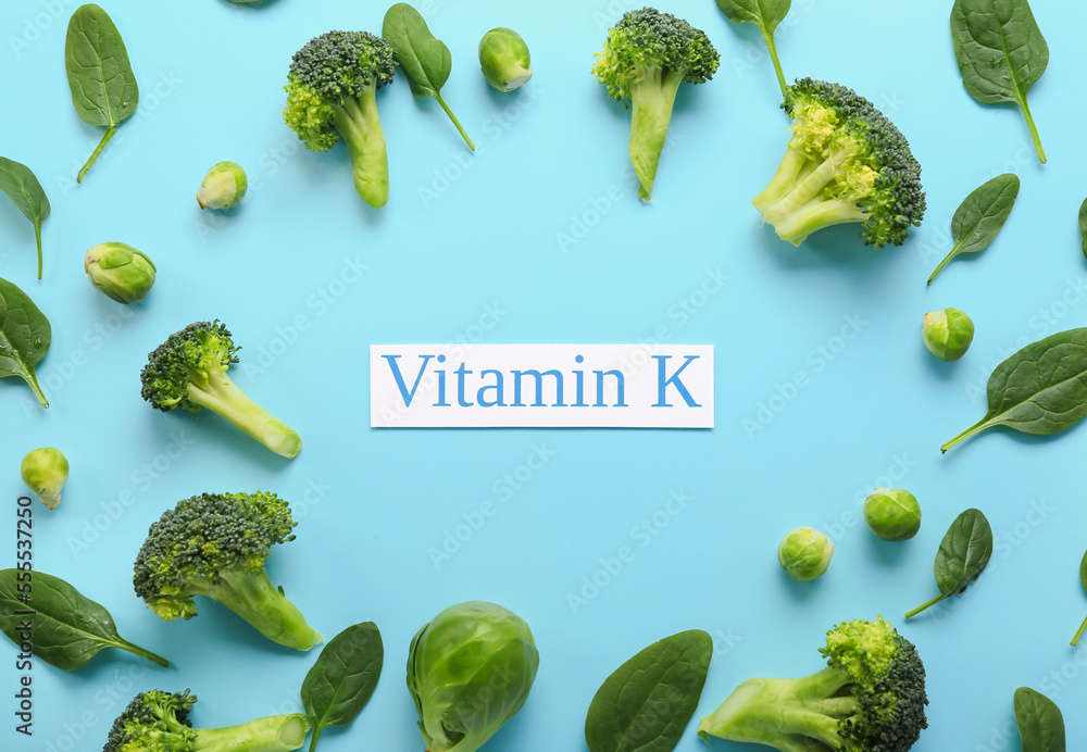 Text VITAMIN K and healthy products on blue background