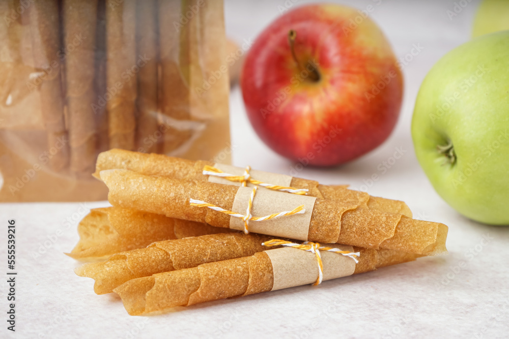 Heap of tasty apple pastilles on light table