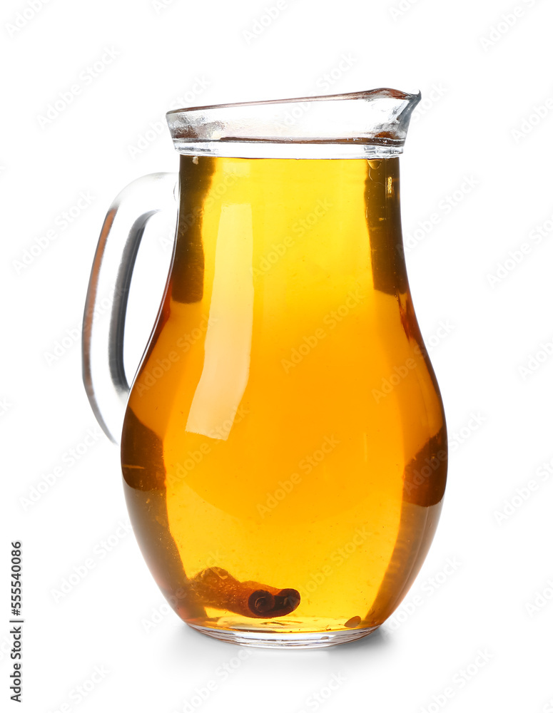 Glass jug of fresh apple juice on white background