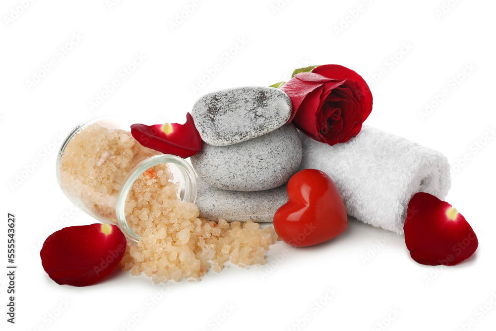 Spa composition for Valentines Day with stones, sea salt and rose on white background