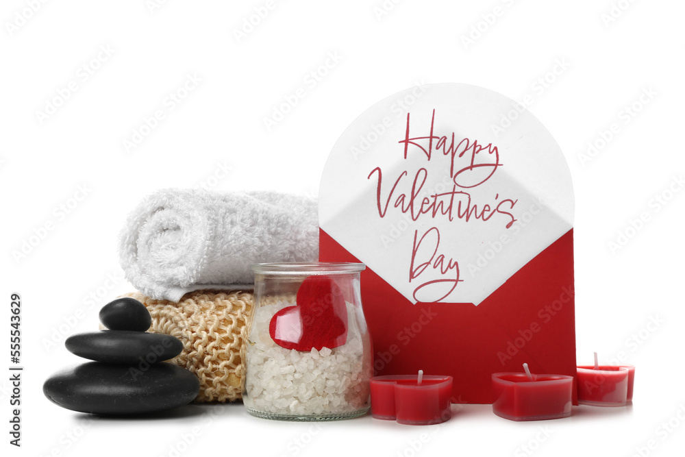 Letter with text HAPPY VALENTINES DAY and spa supplies on white background