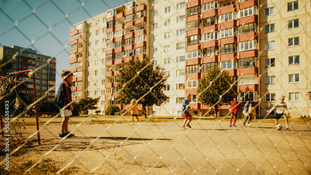 Talented Multiethnic Diverse Kids Playing Soccer in Their Backyard on a Sunny Day in Summer. Sporty 