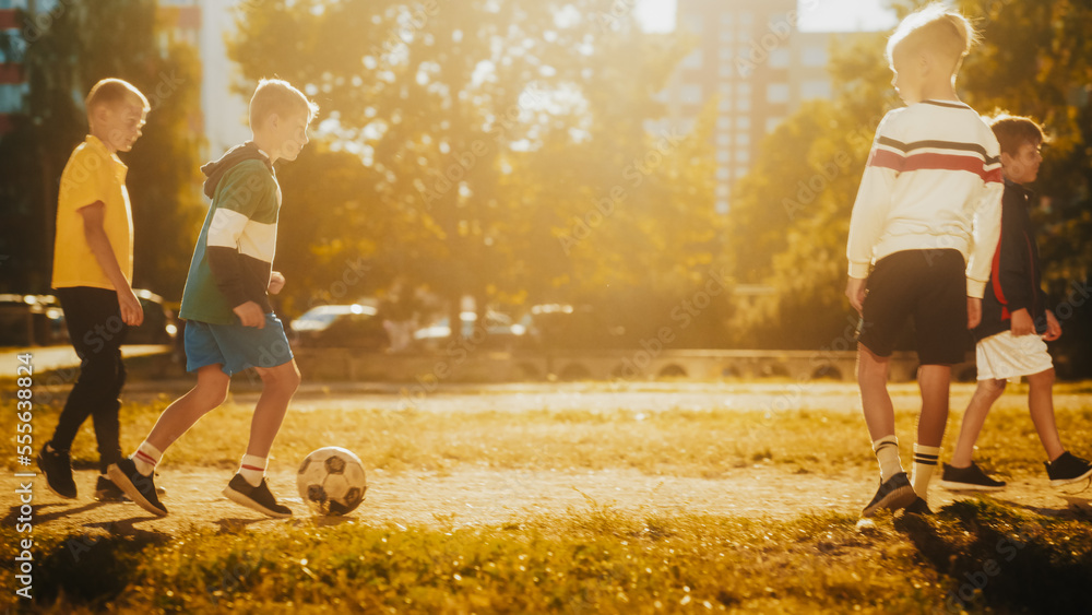 Talented Multiethnic Diverse Kids Playing Soccer in Their Backyard on a Sunny Day in Summer. Sporty 