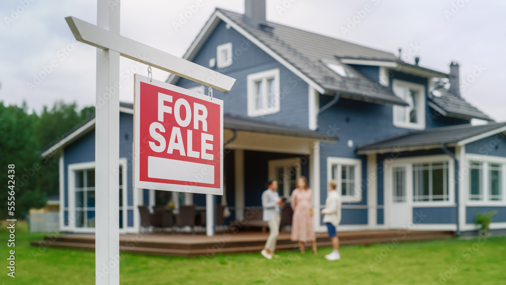 Young Couple Visiting a Potential New Home Property with Professional Real Estate Agent. Female Real